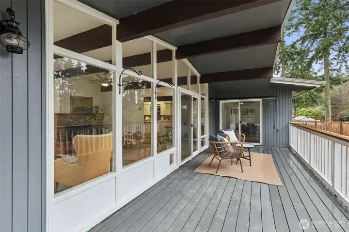 Covered deck with access from living room and 2nd primary bedroom