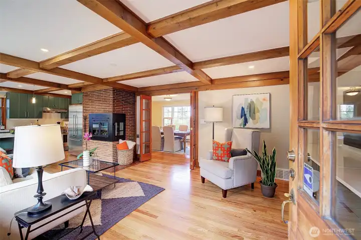 The magic continues as you enter this lovely home. Freshly finished hardwood floors, wood box beamed ceilings, grass mat wall paper.... so much!