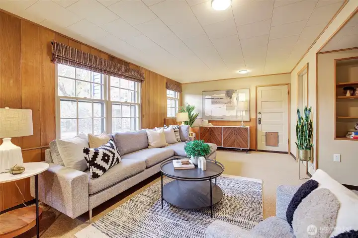 Lots of light in this lower level family room. Entrance to lovely fully fenced year yard.