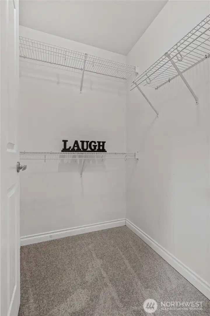 Spacious walk in closet in primary