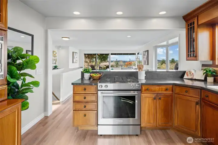 Cook with ease on the gas range while staying connected to the living spaces and outdoor views. Expansive countertops and thoughtful layout make everyday living and entertaining effortless.