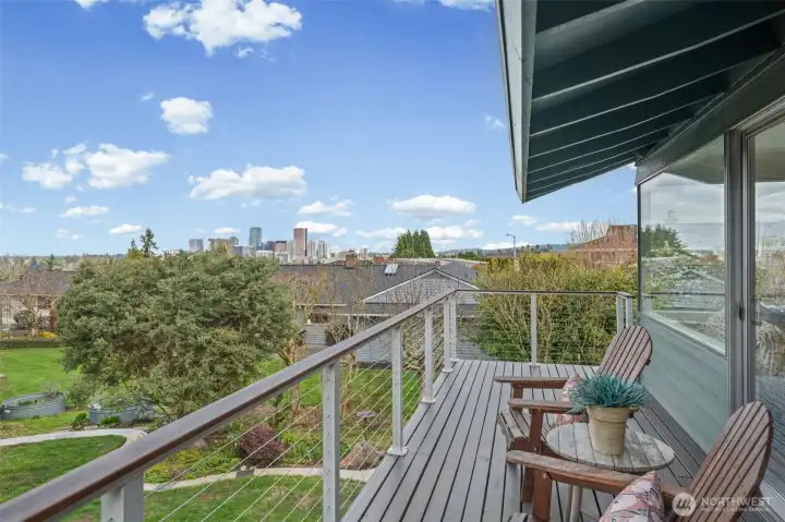 Charming upper deck retreat with space for lounge seating, ideal for morning coffee or evening unwinding while taking in the expansive outlook.