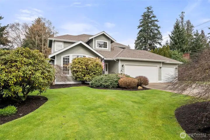Meticulously maintained home with lush grounds.