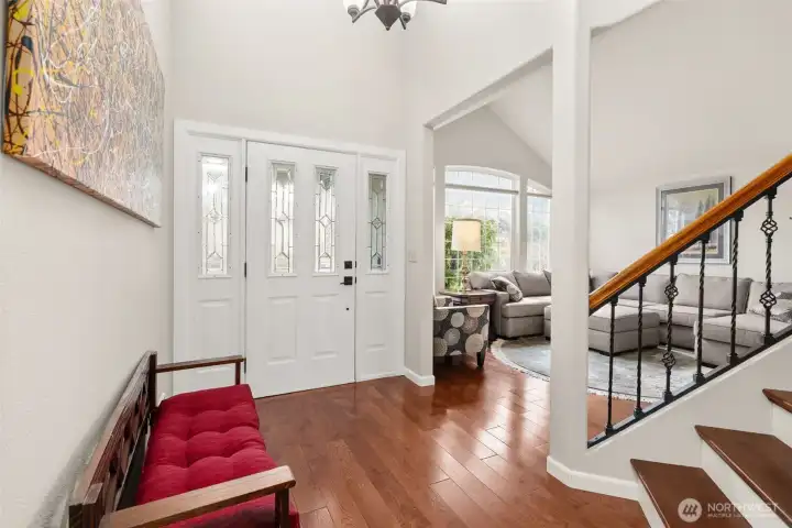 Light-filled entry with soaring ceilings create an inviting first impression