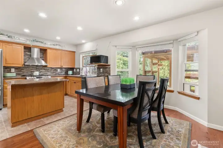 An open-concept kitchen, dining, and living area creates a seamless flow. Perfectly designed for both effortless everyday living and elevated entertaining