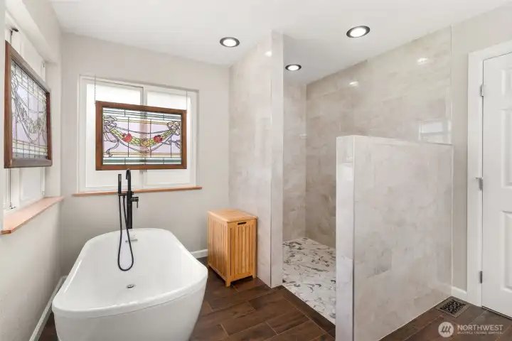 Unwind after a long day in your soaking tub or rejuvenate in the sleek, custom-designed shower