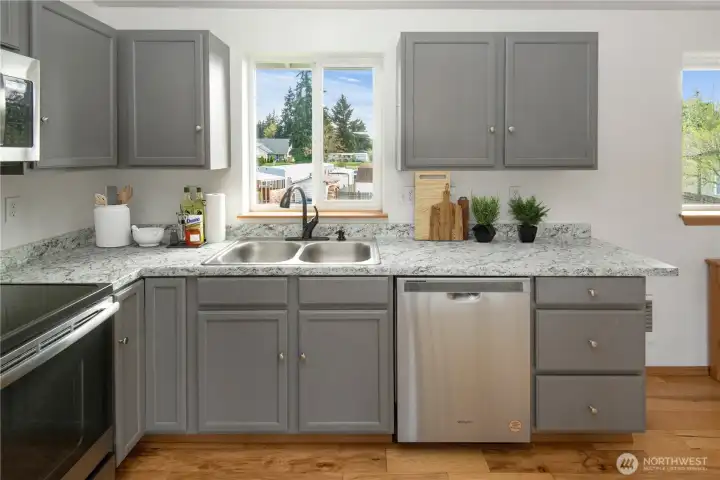 Kitchen with updated countertops and appliances *Virtually Staged*