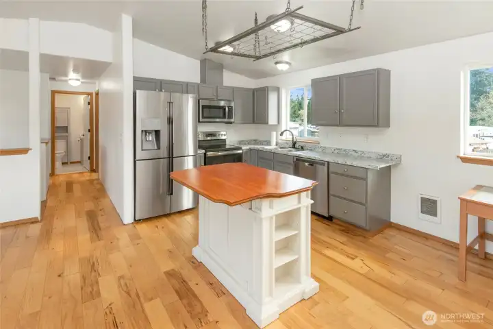 Kitchen with view of hallway into 2 upstairs bedrooms