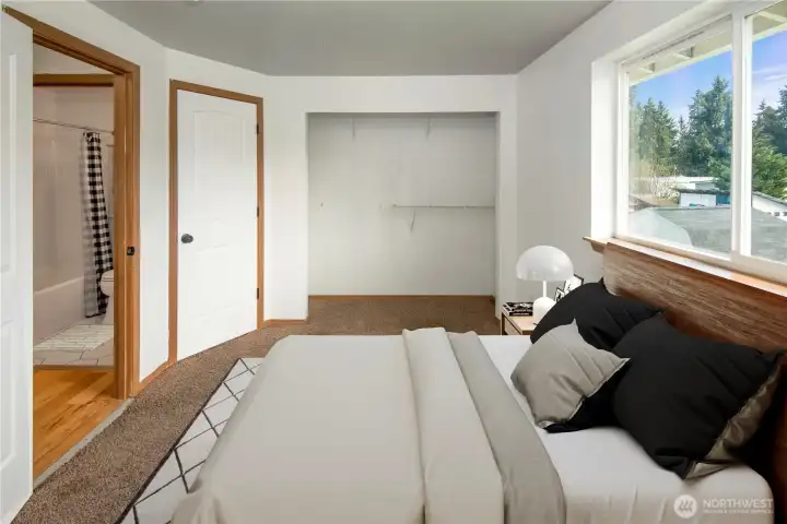 Primary bedroom with shared door to upstairs bathroom *Virtually Staged*
