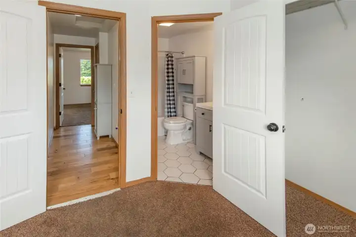 View of bathroom from primary bedroom