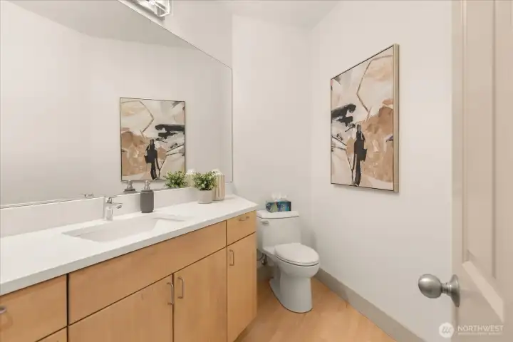 Stylish powder room with refreshed countertops, updated fixtures, and a clean, modern design.