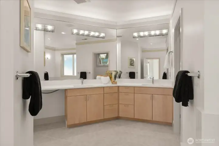 Beautifully updated ensuite featuring a dual vanity with new quartz countertops, updated lighting, and a refreshed walk-in shower and tile surround (professionally refinished). A quartz tub surround completes the space, and a new 80" glass shower door will be installed prior to closing—clean, bright, and move-in ready.