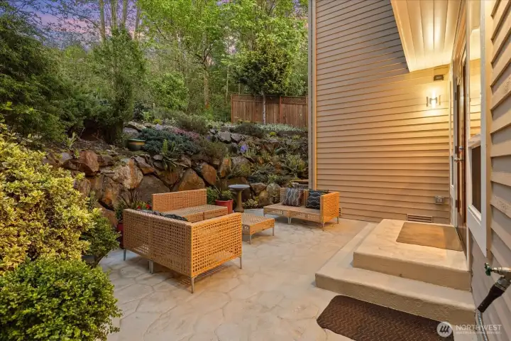 Private, professionally coated patio creating a peaceful outdoor living space—ideal for relaxing or entertaining.