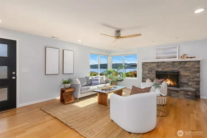 Bright, open living room with stunning water views through corner windows. The ideal space for relaxing or entertaining while taking in the view. Bright, open living room with stunning water views through corner windows. The ideal space for relaxing or entertaining while taking in the view.