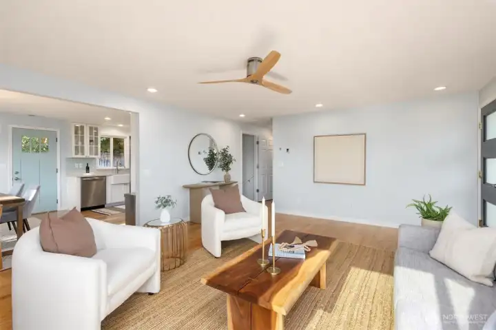 The living room flows seamlessly into the kitchen and dining space. The living room flows seamlessly into the kitchen and dining space.
