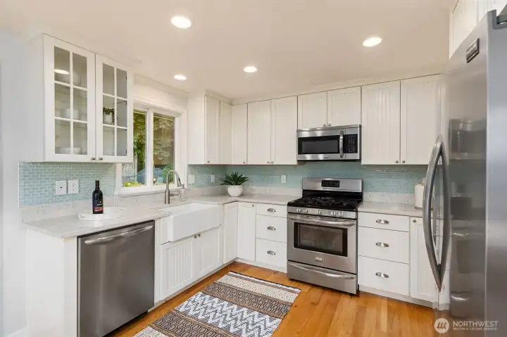 Stylish farmhouse sink with backyard views. Stylish farmhouse sink with backyard views.