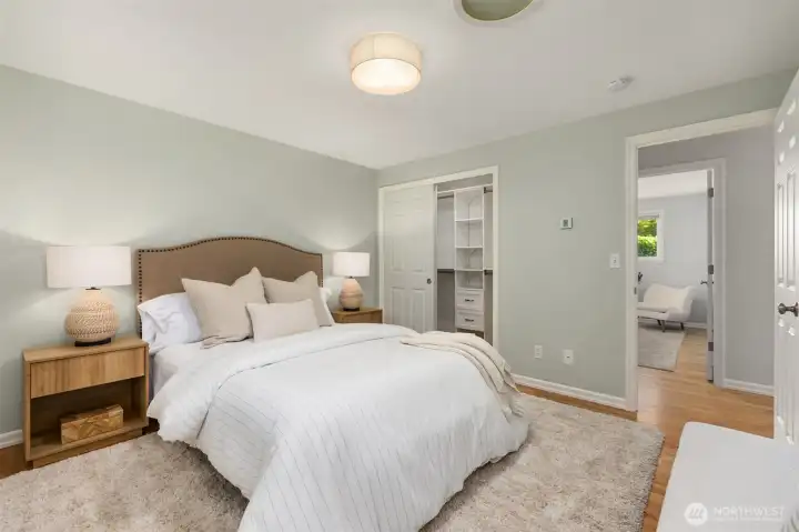 The primary suite offers a closet with built-in shelving. The primary suite offers a closet with built-in shelving.
