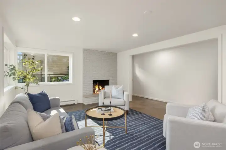 Lower level family room features a painted brick fireplace and polished concrete floors. Lower level family room features a painted brick fireplace and polished concrete floors.