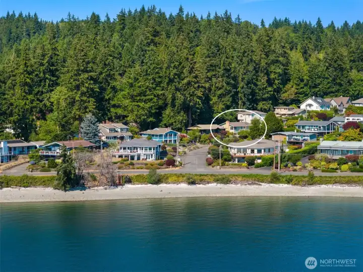 Aerial view highlights the home's location just moments from the beach. Aerial view highlights the home's location just moments from the beach.