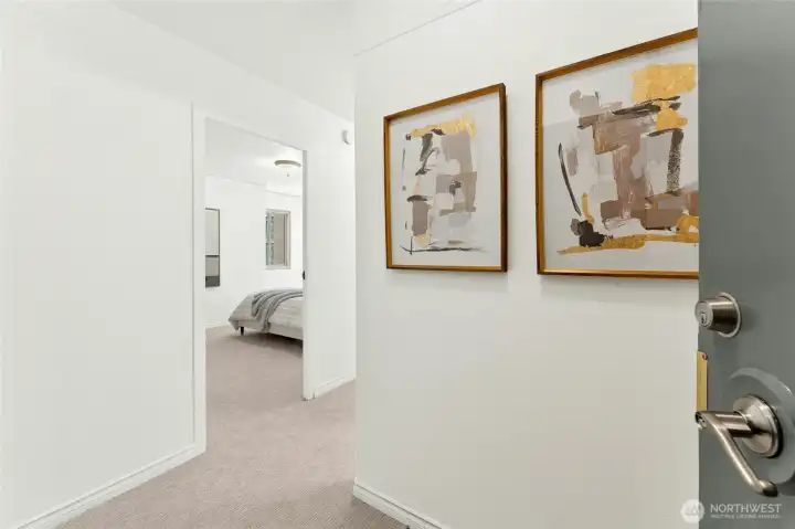 Formal tiled entry with two closets, one a walk-in for plenty of storage.