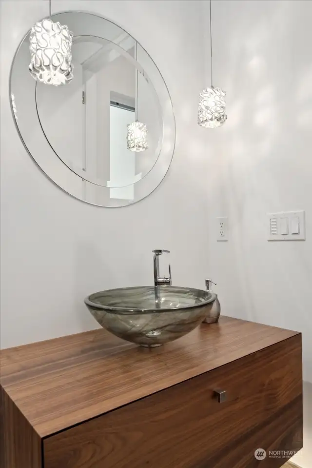 Powder room off the front entrance with modern touches