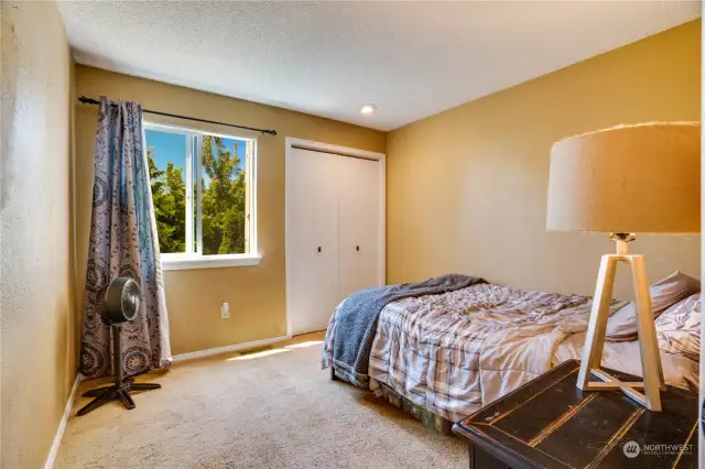 Enjoy the view out of this generous window from this first upstairs bedroom!