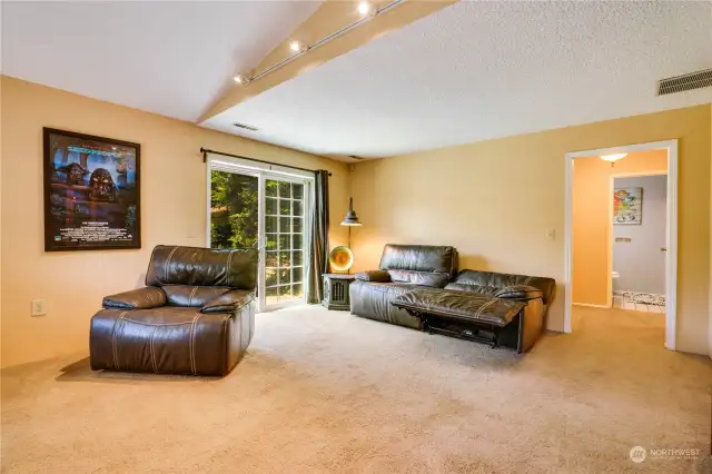 Notice the sliding glass door out to the lower patio and fully fenced, secluded backyard.