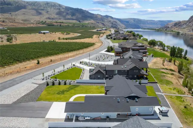 Aerial view 1 of home overlooking the Columbia River with surrounding orchards.