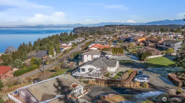 Looking North over the neighborhood and to Mt. Baker. You can also see the Canadian Cascades & Grouse Mountain. You can see in this picture that there is plenty of off street parking out front of the house. Hard to find this much parking on a private lane with these kinds of views.  Great for entertaining and visitors.