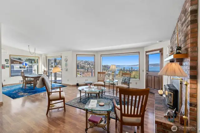 Living room with gorgeous views towards Utsalady Point. Large windows for lots of natural light and doors to your outdoor living.