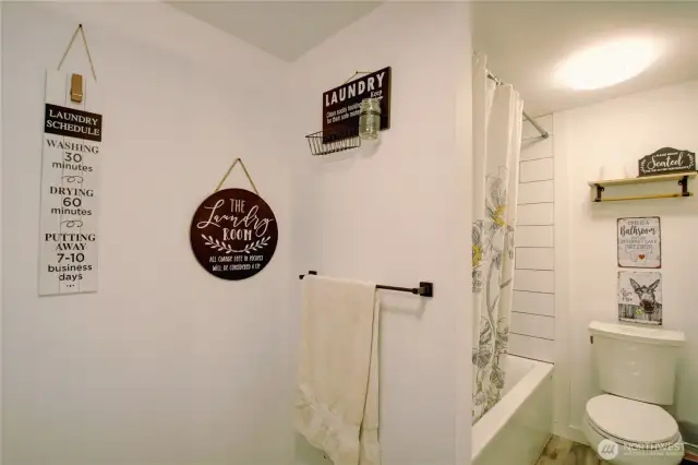 Tub/shower combo with tile.