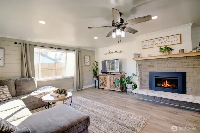 Gorgeous gas fireplace will greet you as you step into the comfortable open living space.