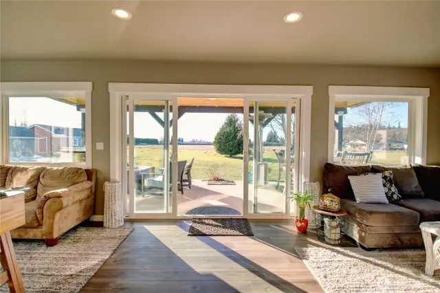 Sliders open to covered patio. Enjoy the amazing sunsets from this room!