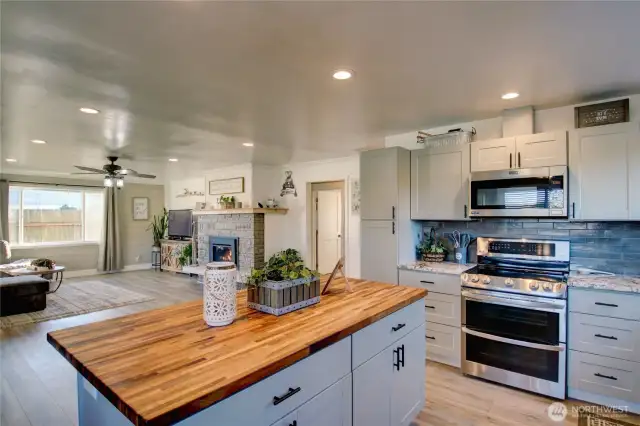 Large kitchen with butcher block island making a great place to cook and entertain.