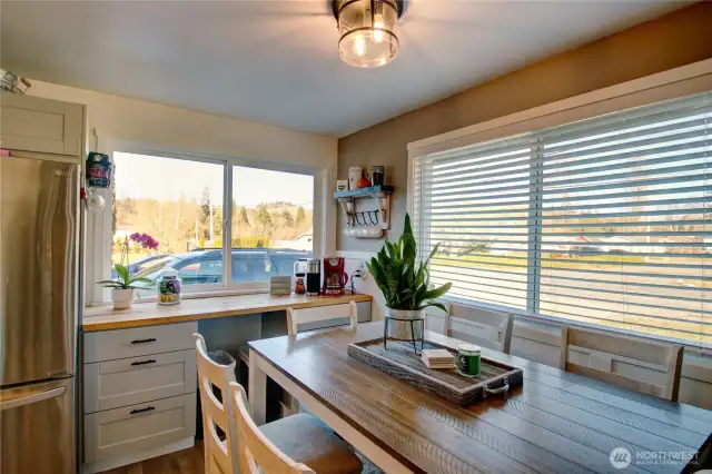 Kitchen eating nook and coffee bar under the window.