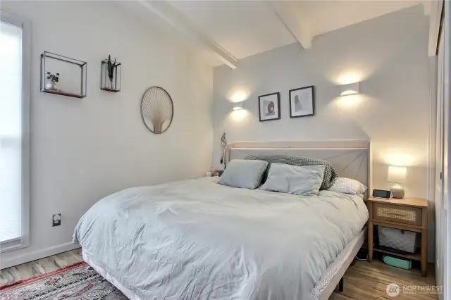 Another view of the Bedroom and note the gorgeous custom blinds with blackout option for a restful sleep either at night or day.