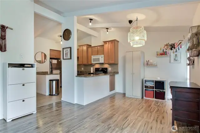 View from the living room showing the dining area and beautiful kitchen.