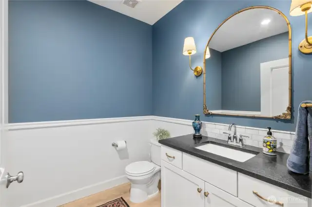 1/2 bath powder room with enough space for shower to be added.