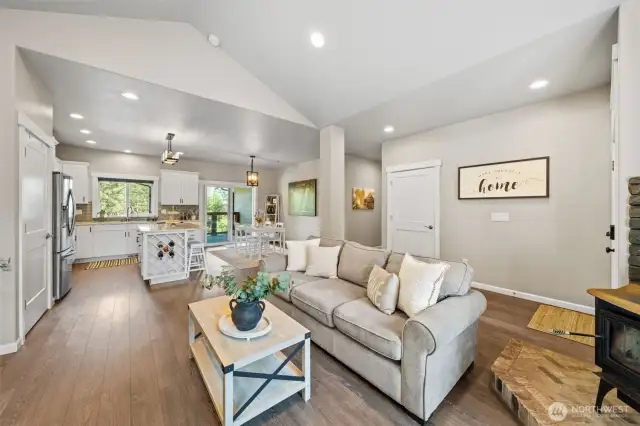 open concept at its finest with the living room having great flow from kitchen to dining room