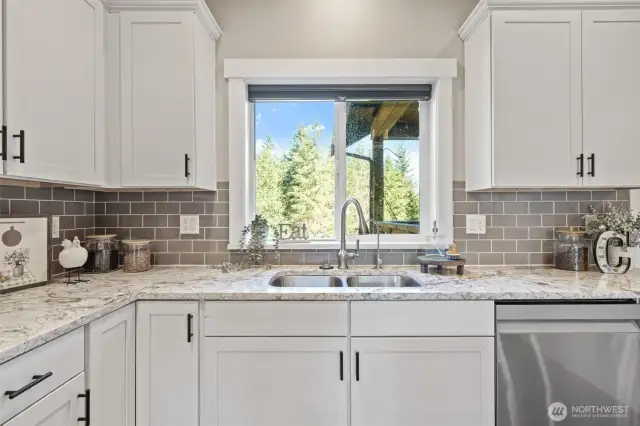 this beautiful kitchen window looks over the back yard where you can watch the deer as you do your dishes