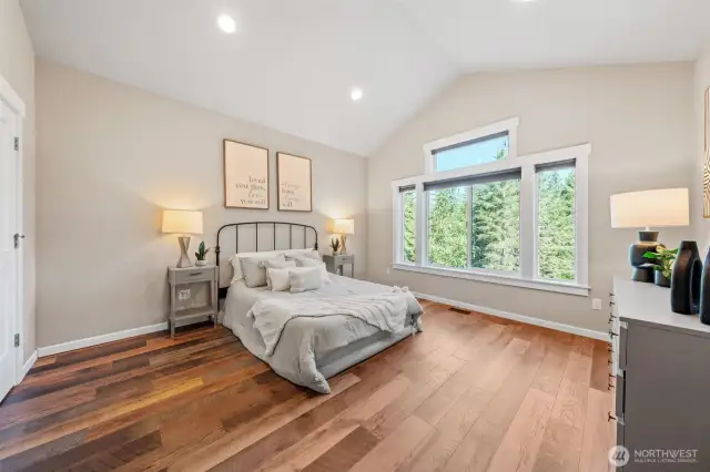 primary bedroom with a lovely view of your 5-acre property!