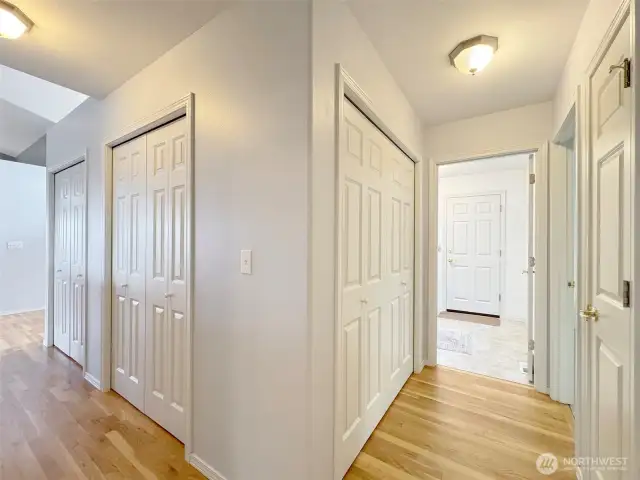 Multiple hallway storage closets.