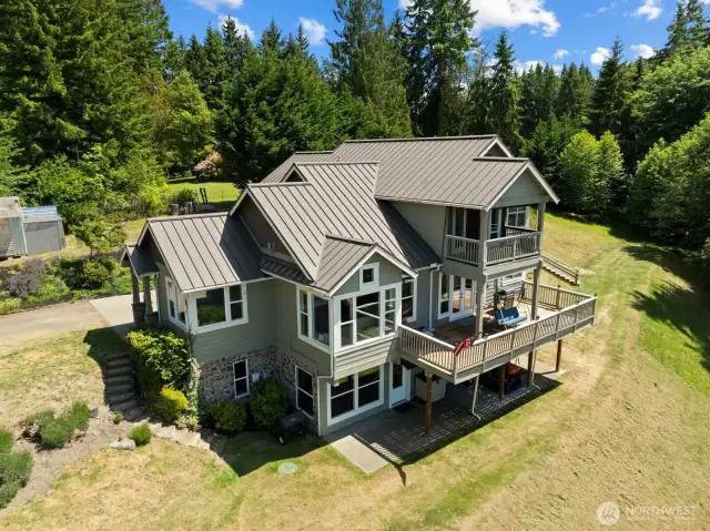 This custom built home on a secluded 2.5 acre lots was designed to take in the stunning NW views.