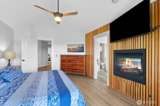 The beautiful primary suite with built in gas fireplace and unique access wall. I think you be impressed.