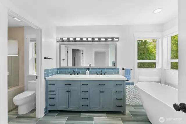 The large newly updated primary 5-piece bath is stunning.