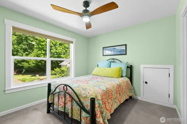 Upstairs guest bedroom #2, door is for attic access.