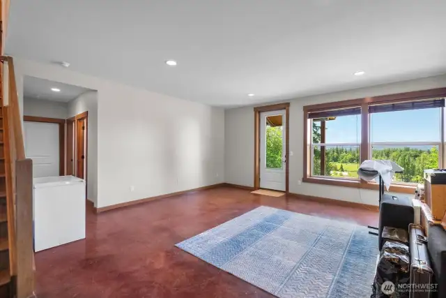 Downstairs family room with heated acid washed concrete floors and stunning view, very nice!!