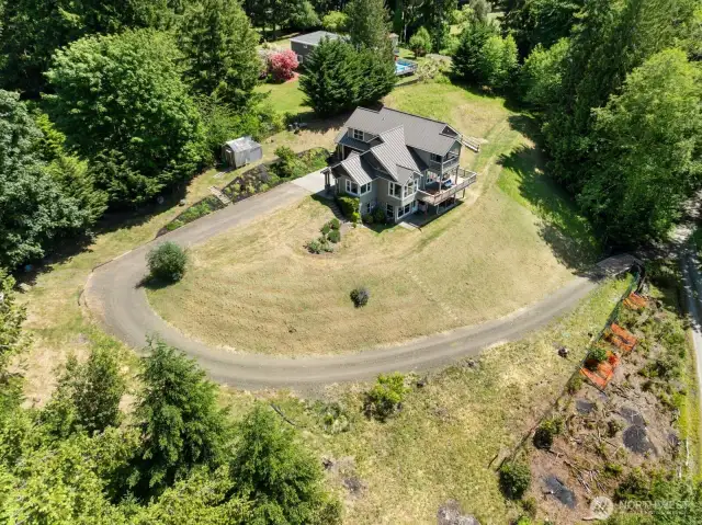 You will love the privacy provided on this 2.5 acre property. The driveway has an automatic electric gate, a very nice touch.
