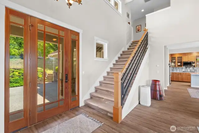 The large 8ft door is impressive and the custom steel banister adds to contemporary vibe of this stunning home.