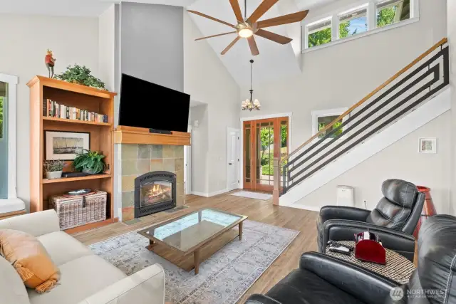 The vaulted ceilings add light and dimension to this wonderful great room. The door on the left goes to the main floor office.